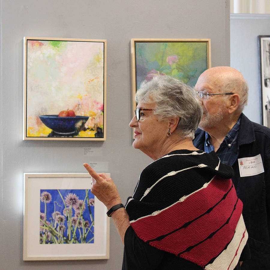 Two attendees at gallery show opening